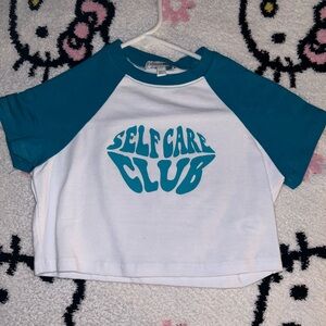 very cropped teal and white top